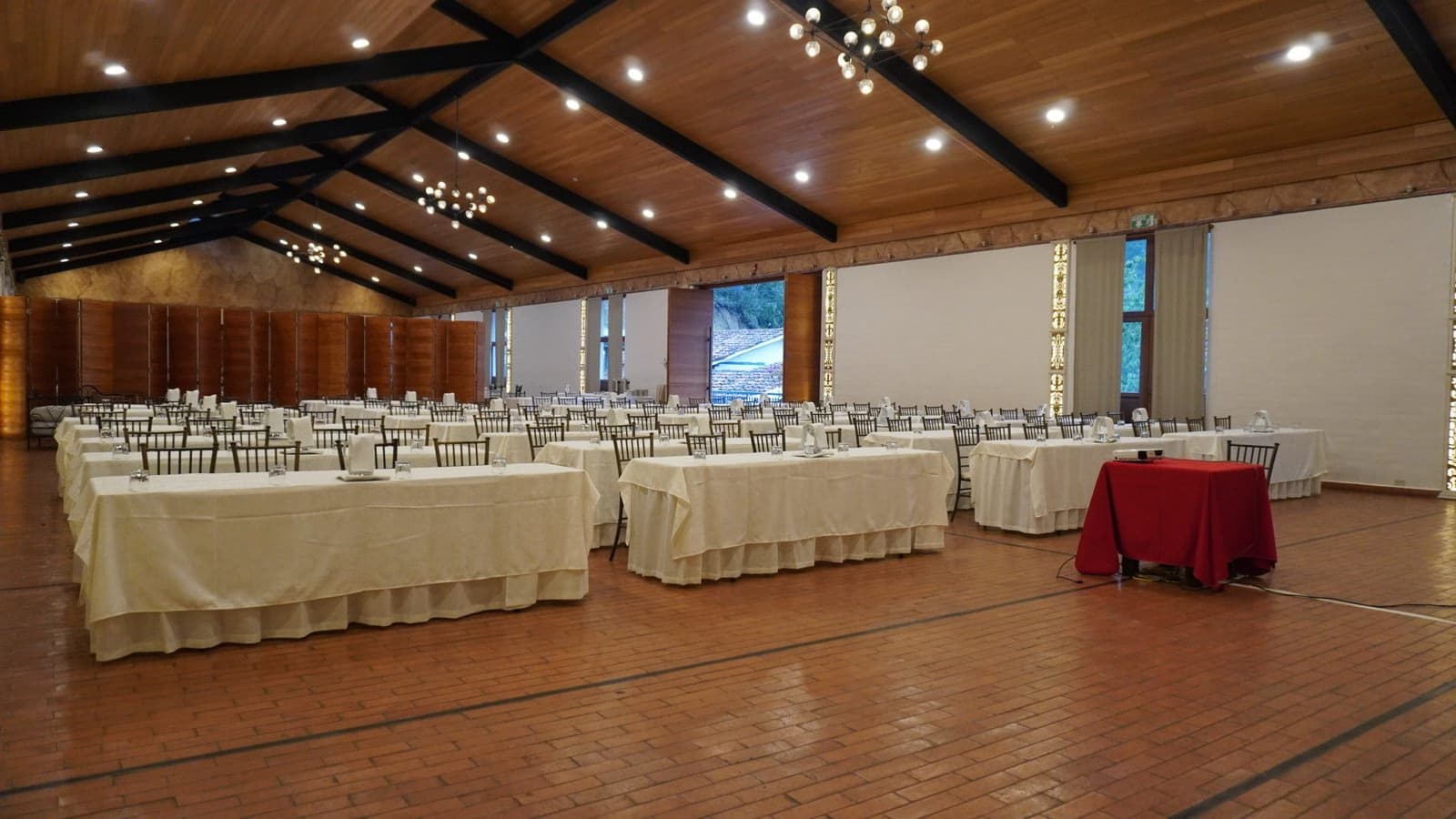 Corporate event setup with stage and lights at Estancia Rosario.